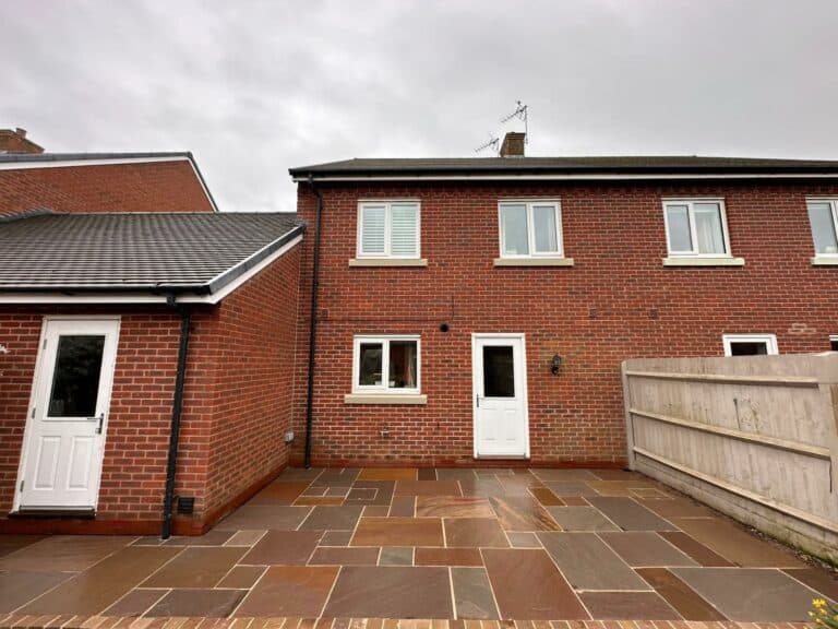 Heritage Paving installed sandstone patio